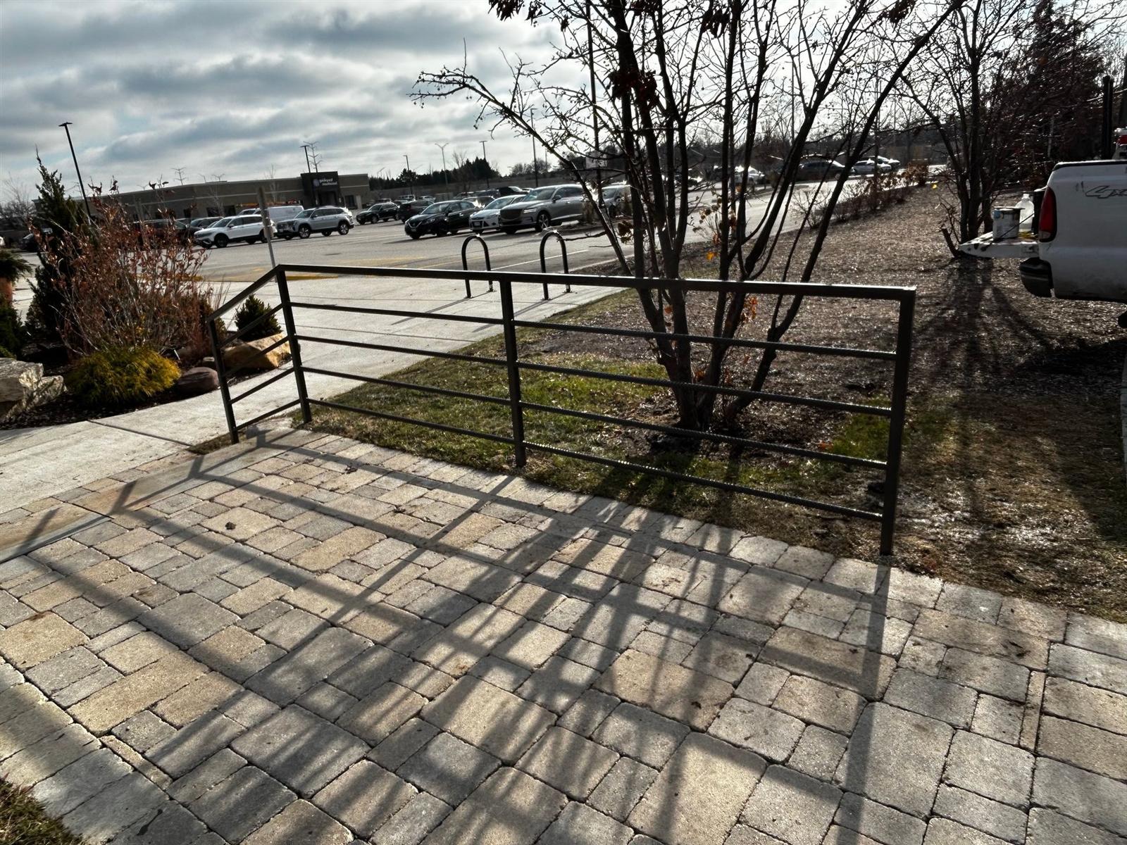 Steel guard railing fabricated for a commercial walkway and parking area